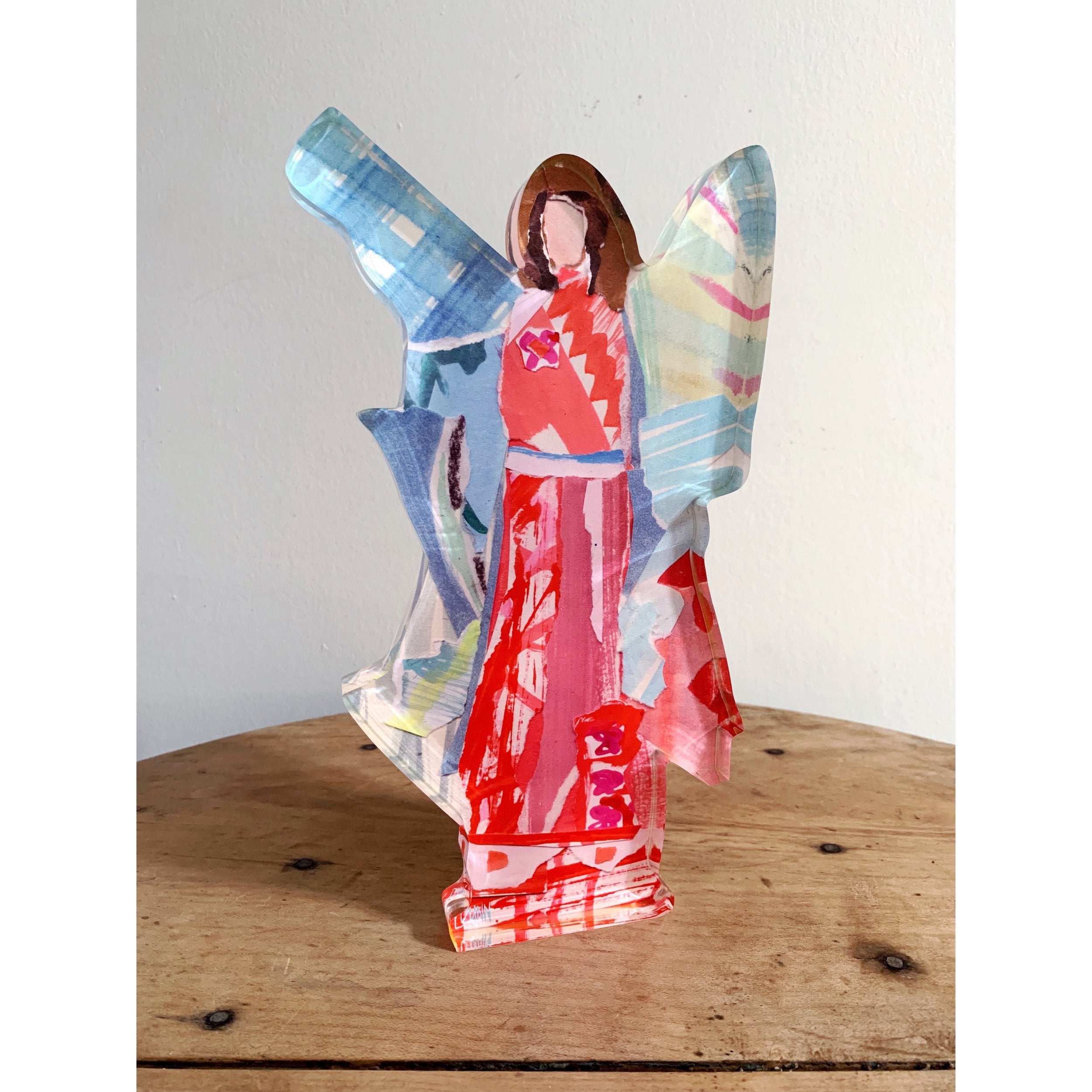 red collage acrylic angel with wings